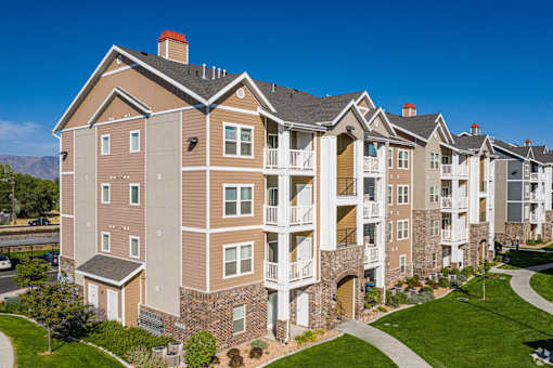 A large apartment complex with multiple buildings and balconies.