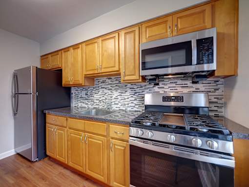 Kitchen with wooden cabinets at Garwood Gardens Apartments, New Jersey, 07027