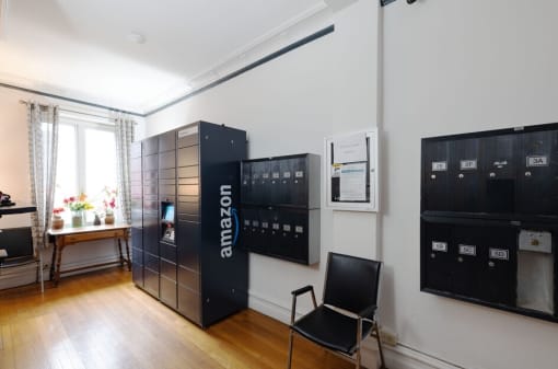 a room with a chair and a filing cabinet on the wall