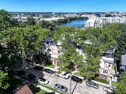 A view of a city from above with cars and buildings.