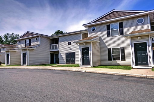 a row of houses on the side of a street