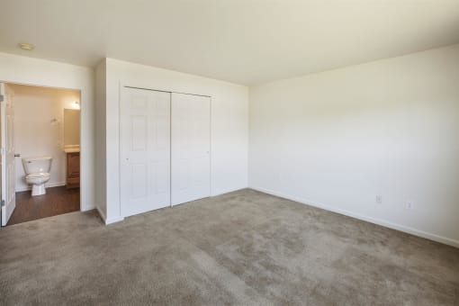 a room with carpet and a toilet in it