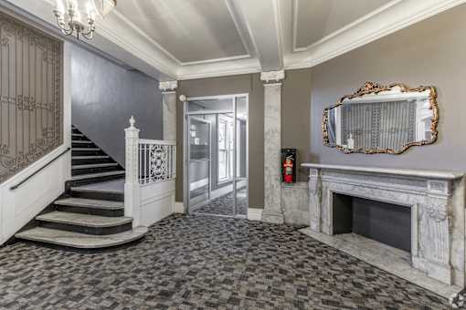 Large room with a fireplace at Willett Apartments, Albany