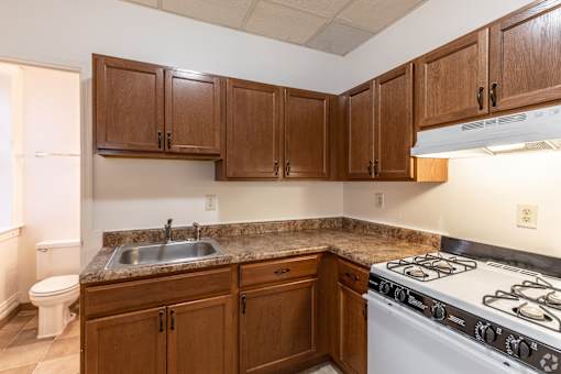 Kitchen with white stove at Willett Apartments, Albany, NY, 12210