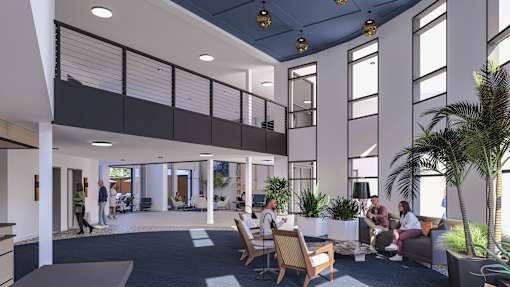 A group of people are sitting in a modern office space.