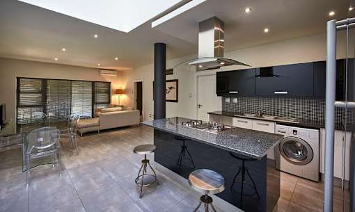 a kitchen with a sink and a washing machine