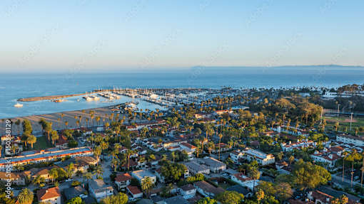A coastal town with a pier and a body of water.