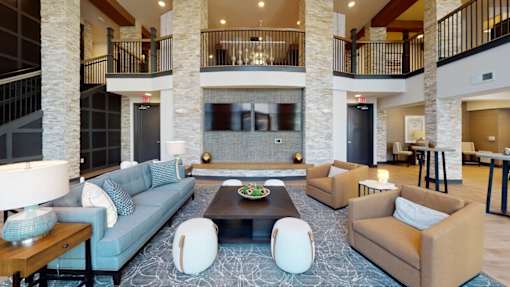 a large living room with couches and a coffee table