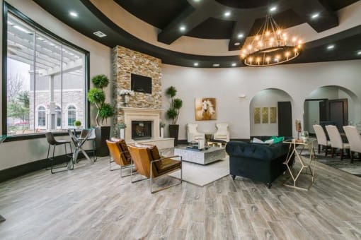 a living room with a fireplace and a large window