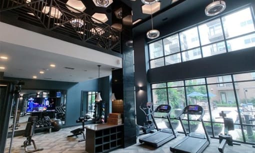 a gym with treadmills and other exercise equipment