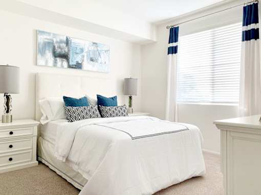 a bedroom with a bed and a tv