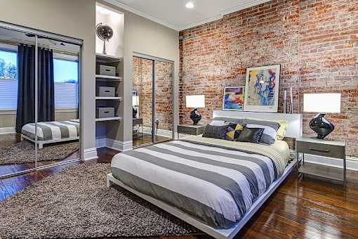 bedroom with mirrored closet doors