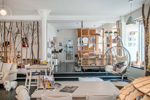 a living room filled with furniture and a large window