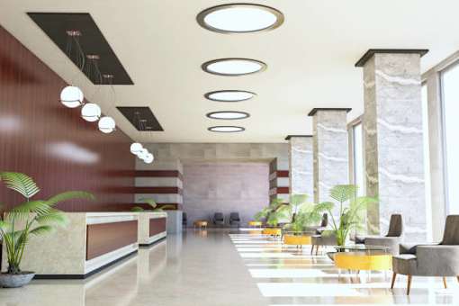 a rendering of a lobby with yellow chairs and a reception desk