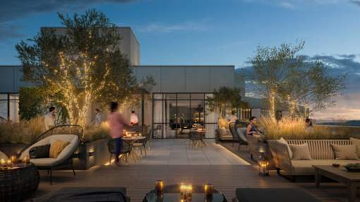 a rendering of the rooftop terrace at night with people and trees