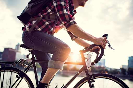 guy riding bike in city