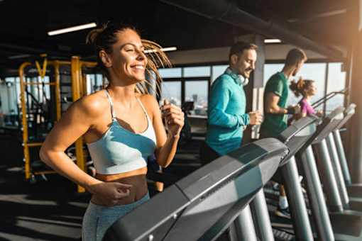 a group of people running on a treadmill