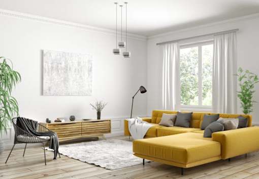 a living room with white walls and a yellow sofa