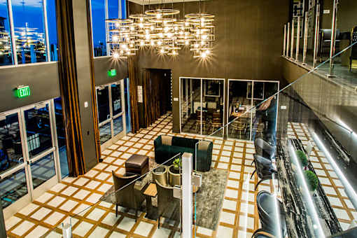 a view of the lobby of a hotel with couches and chairs