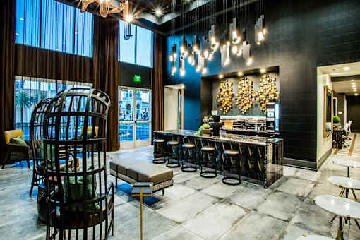 a restaurant with a bar and a blue wall