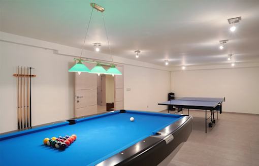 a game room with a pool table and