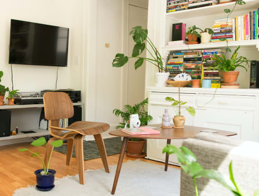 a living room filled with furniture and a flat screen tv