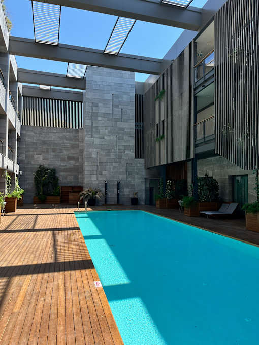 A modern house with a pool in the backyard.
