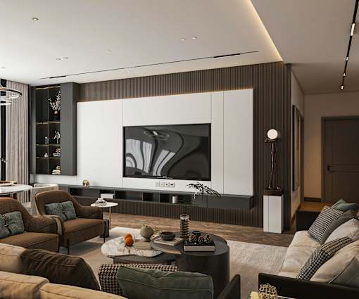 A modern living room with a large flat screen TV mounted on the wall.