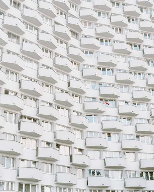 a fragment of the facade of a white apartment building premium photo