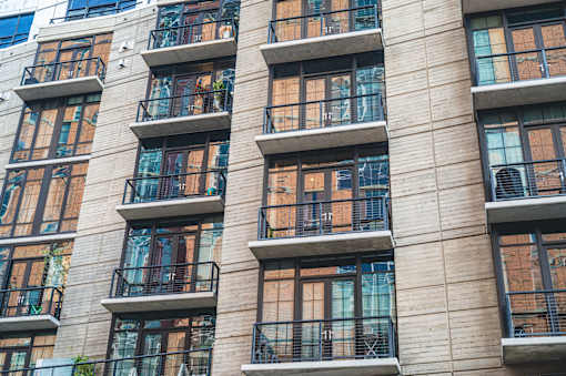A building with many windows and balconies.