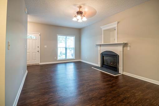 A room with a fireplace and a window.