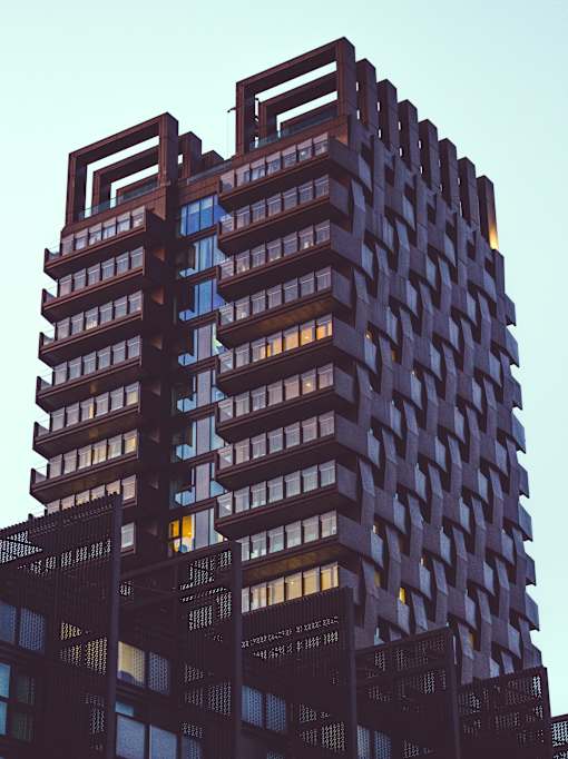 a tall building with a blue sky in the background