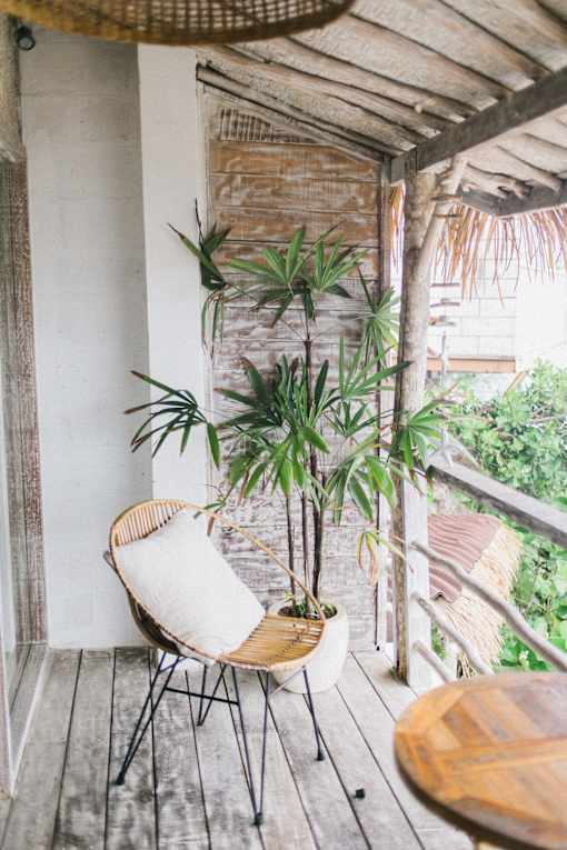 balcony with chair and plants
