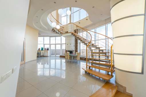 a spiral staircase in a lobby of a building