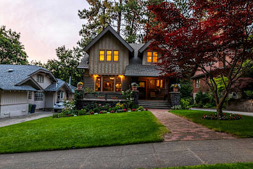 A house with a stone pathway leading to the front door.