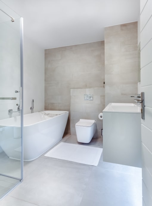 a bathroom with a bathtub sink and toilet in a 555 waverly unit