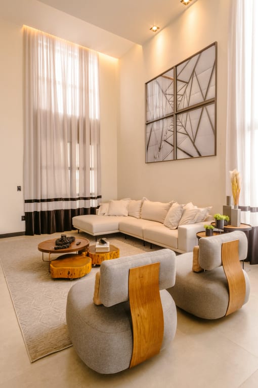 a living room filled with furniture and a large window