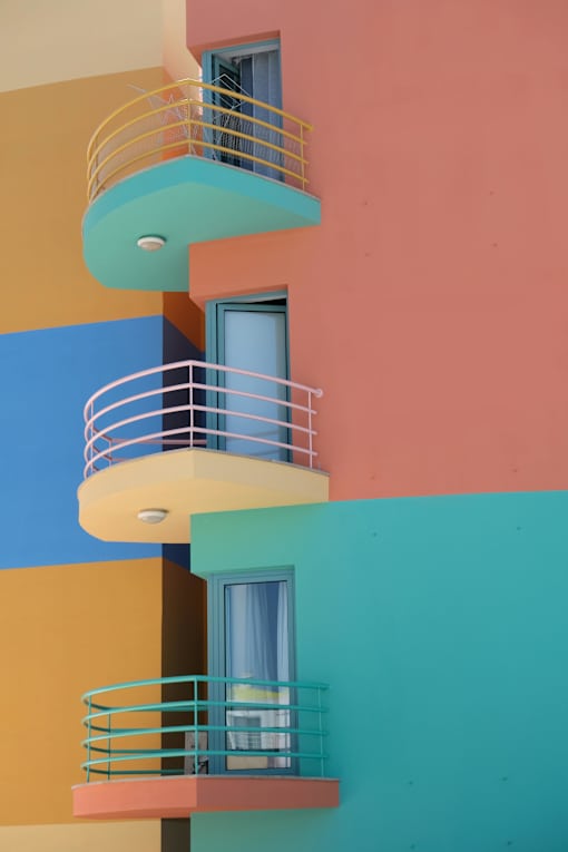 A building with a balcony and a window.