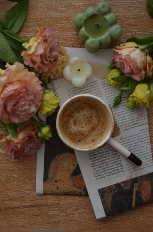 a cup of coffee and a book