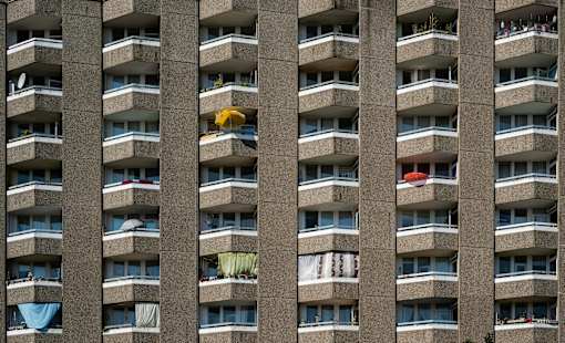 an apartment building with balconies and clothes hanging out of the windows