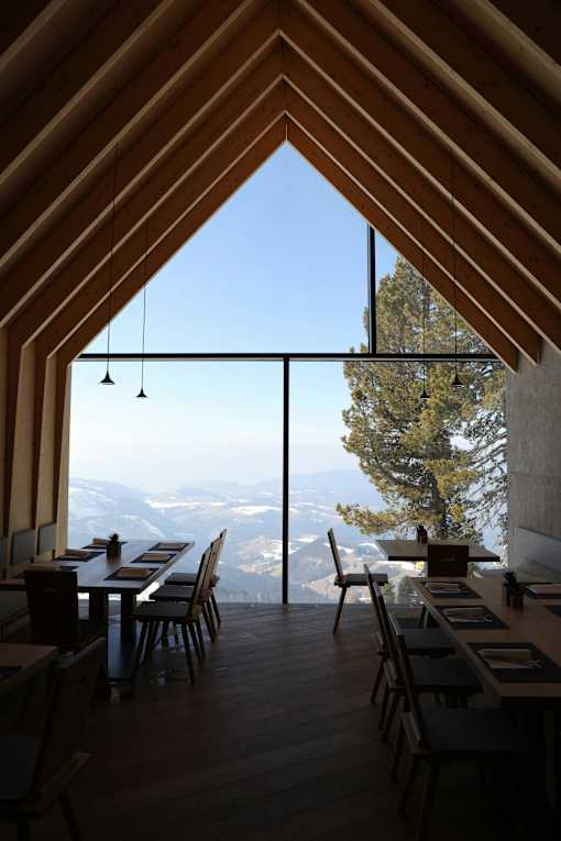 A dining room with a view of the mountains.
