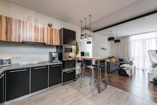 a kitchen and living area in a 555 waverly unit