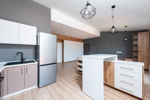 a kitchen and dining area in a 555 waverly unit