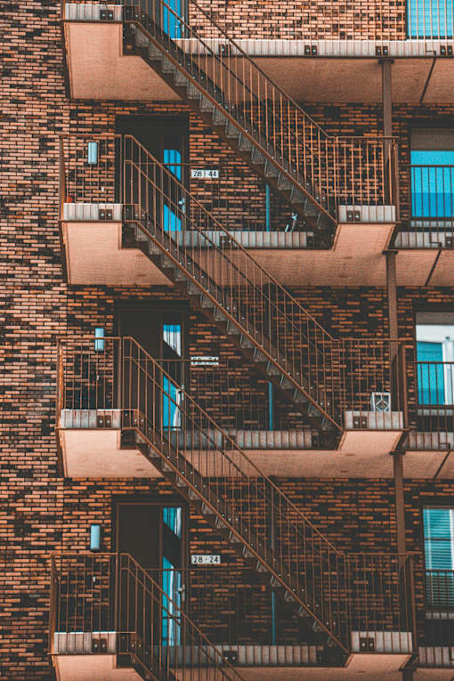 A building with a fire escape on the side.