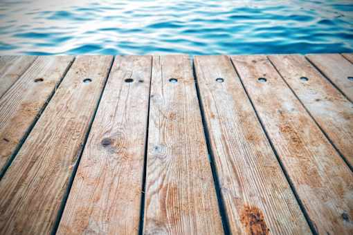 A wooden dock extends into a body of water.