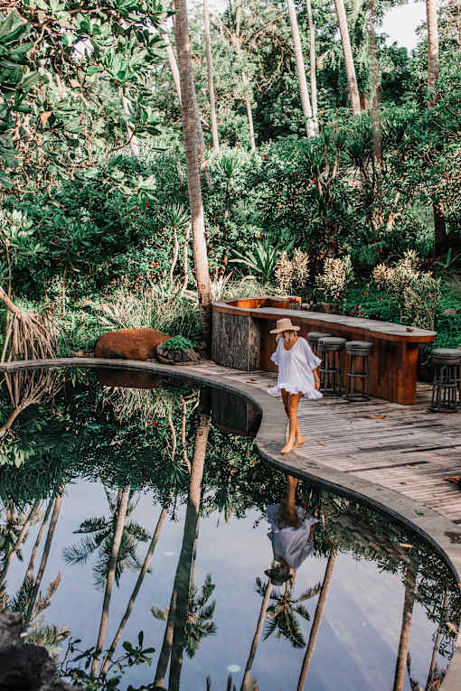 pond with walkway and female reflection
