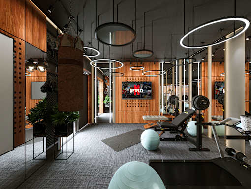 A gym with a variety of equipment including a treadmill, weights, and exercise balls.