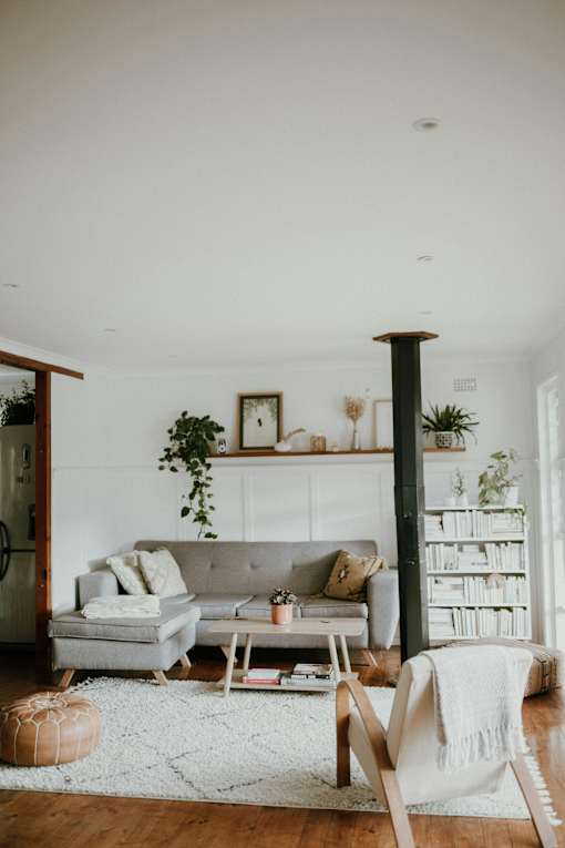 a living room with a couch and a rug