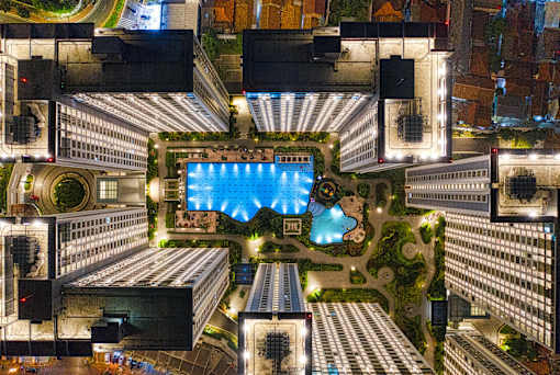 A large building with a pool in the middle of it.