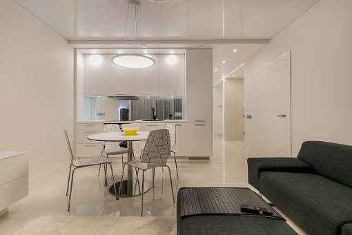 a small dining area next to the kitchen in a 555 waverly unit